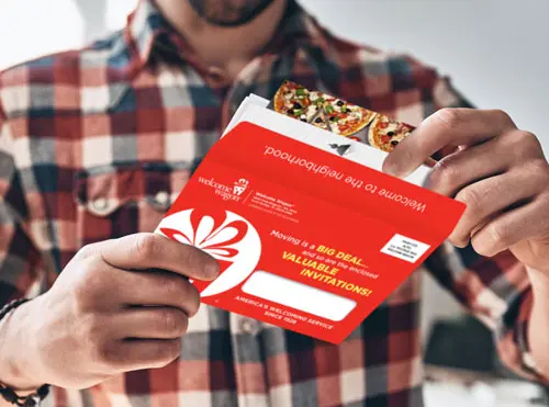 man opening direct mail